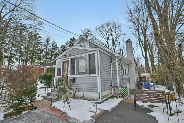 a view of a house with a yard and a garden
