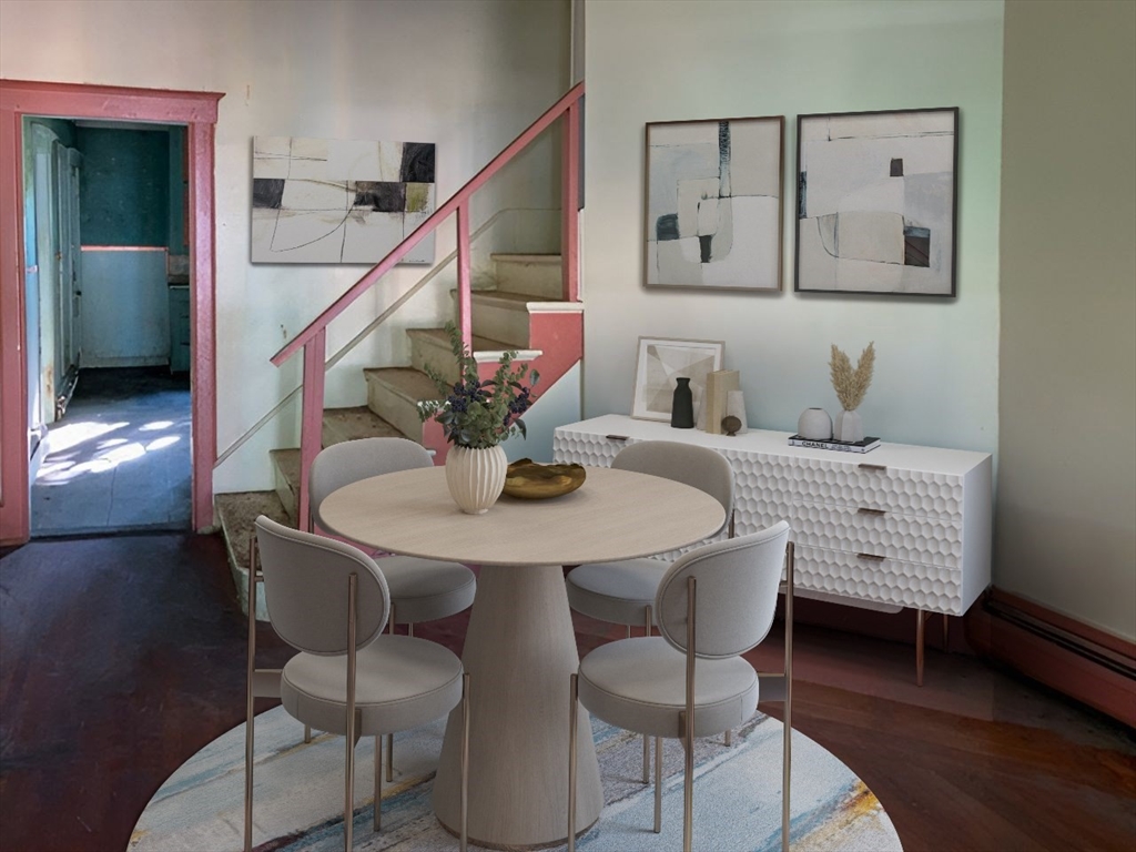 11-15 Perry Street North Adams, MA 01247 - Photo 16 of 22 a view of a dining room with furniture and wooden floor
