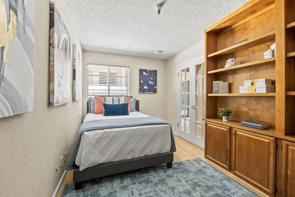 a bedroom with a bed and a closet