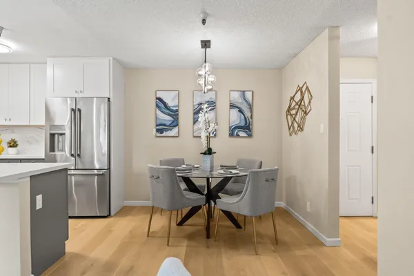 a view of a dining room with furniture window and wooden floor