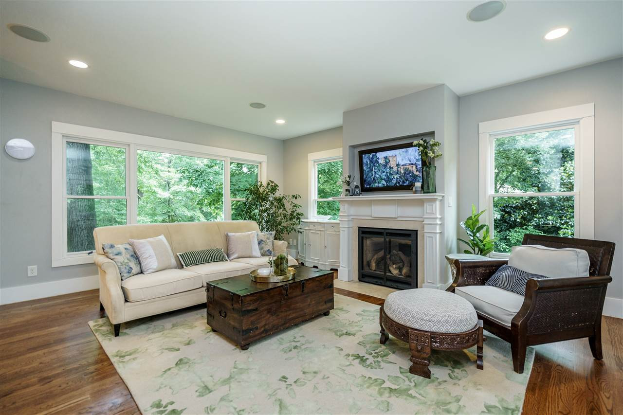 2713 Kilgore Avenue Raleigh, NC 27607 - Photo 10 of 30 the large windows bring in natural light and great backyard views. The gas logs are remote controlled. family room