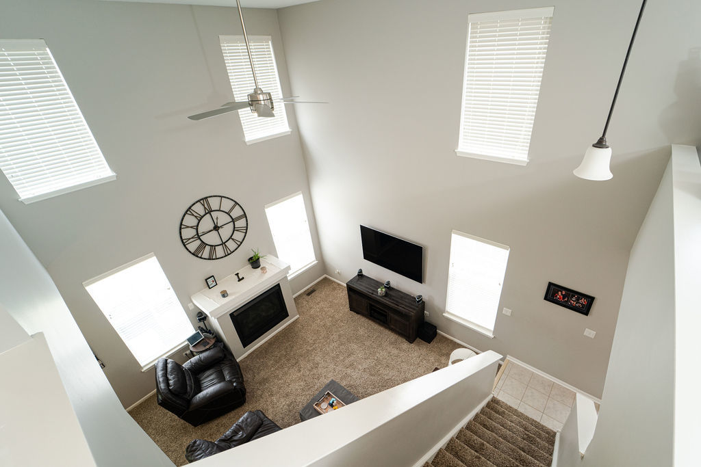 364 Littleton Trail Elgin, IL 60120 - Photo 13 of 36 a living room with furniture and a flat screen tv