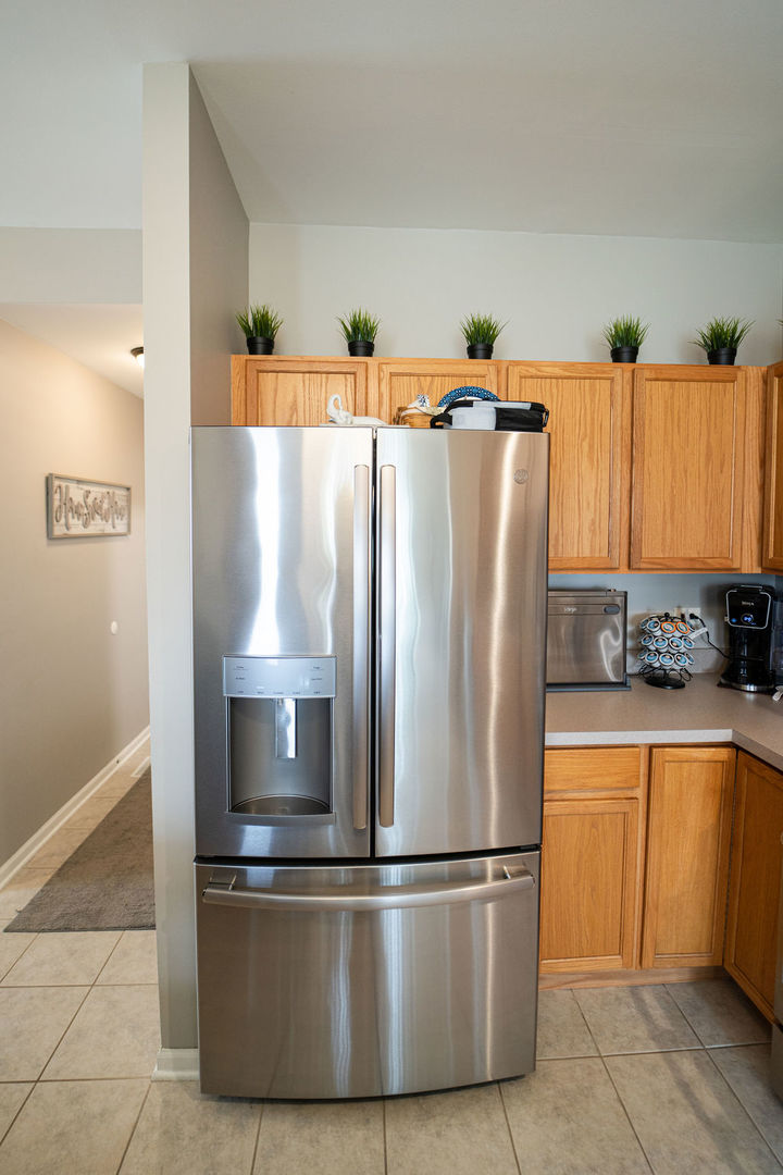 364 Littleton Trail Elgin, IL 60120 - Photo 19 of 36 a white refrigerator freezer sitting inside of a kitchen