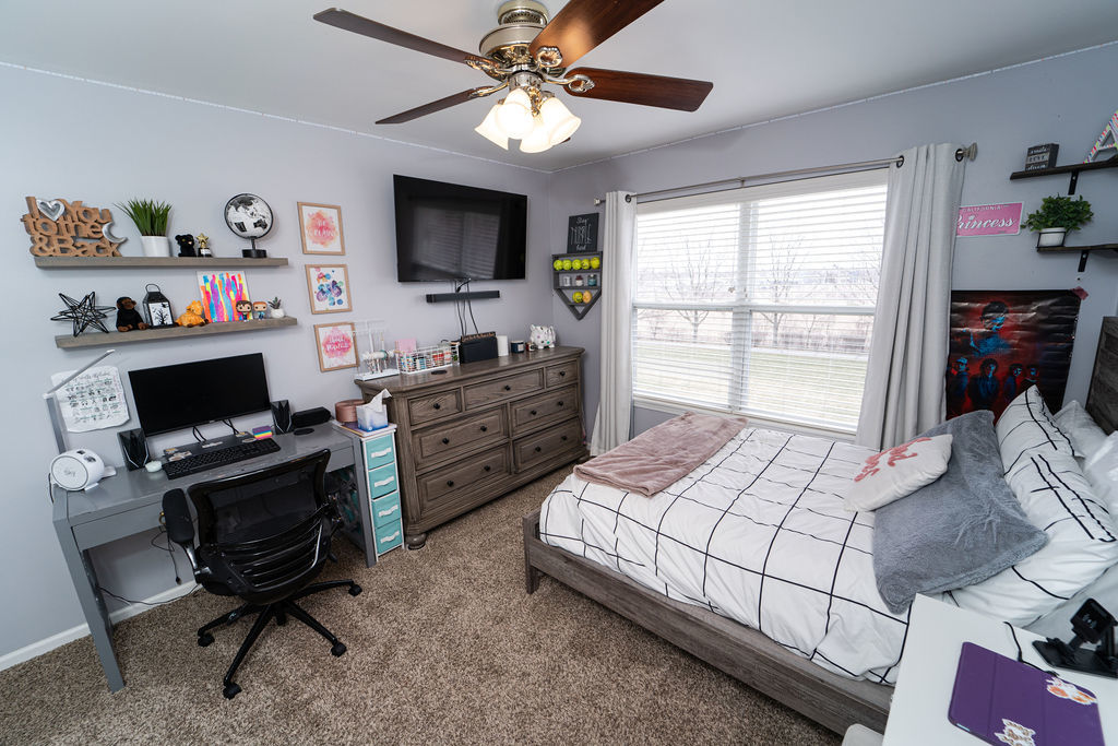 364 Littleton Trail Elgin, IL 60120 - Photo 23 of 36 a bedroom with a bed window and a flat screen tv