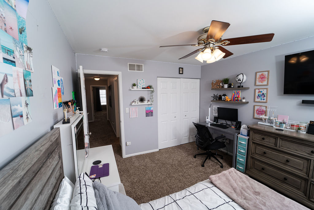 364 Littleton Trail Elgin, IL 60120 - Photo 25 of 36 a room with furniture a flat screen tv and a window