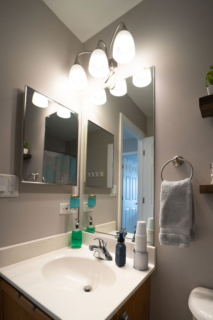 364 Littleton Trail Elgin, IL 60120 - Photo 27 of 36 a bathroom with a sink a mirror and a light fixture