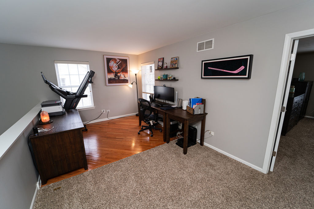 364 Littleton Trail Elgin, IL 60120 - Photo 28 of 36 a living room with furniture and a flat screen tv with wooden floor