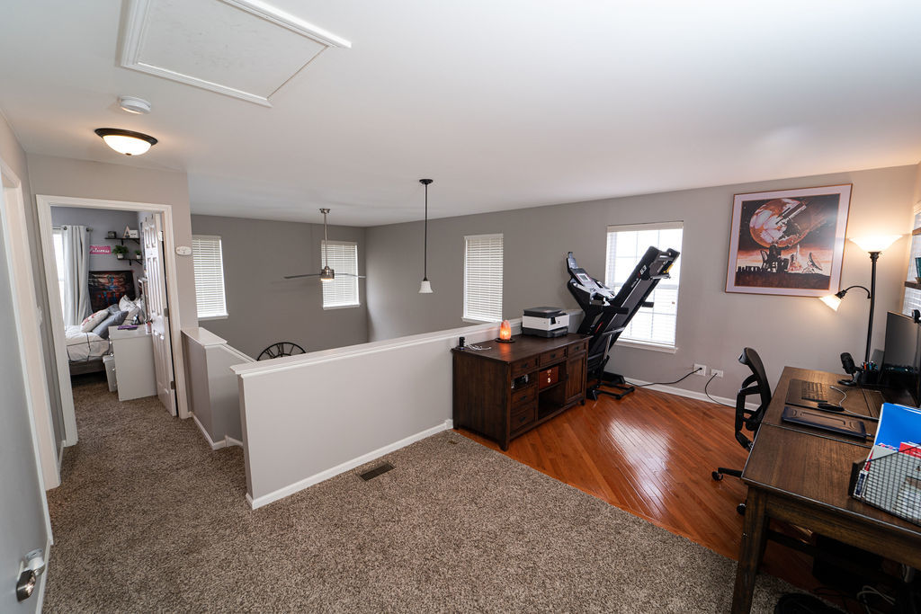 364 Littleton Trail Elgin, IL 60120 - Photo 30 of 36 a living room with furniture and a flat screen tv