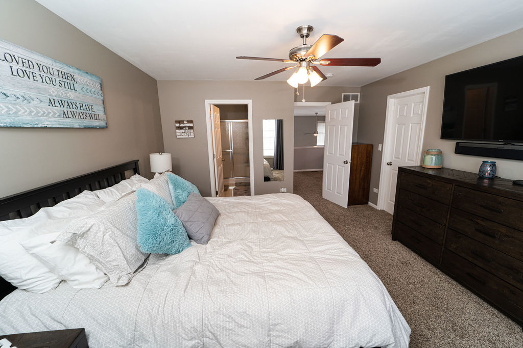 364 Littleton Trail Elgin, IL 60120 - Photo 32 of 36 a bedroom with a bed and a flat screen tv