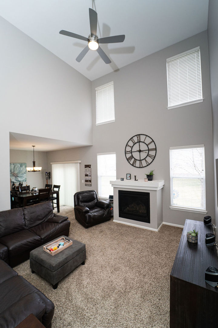 364 Littleton Trail Elgin, IL 60120 - Photo 8 of 36 a living room with furniture and a fireplace