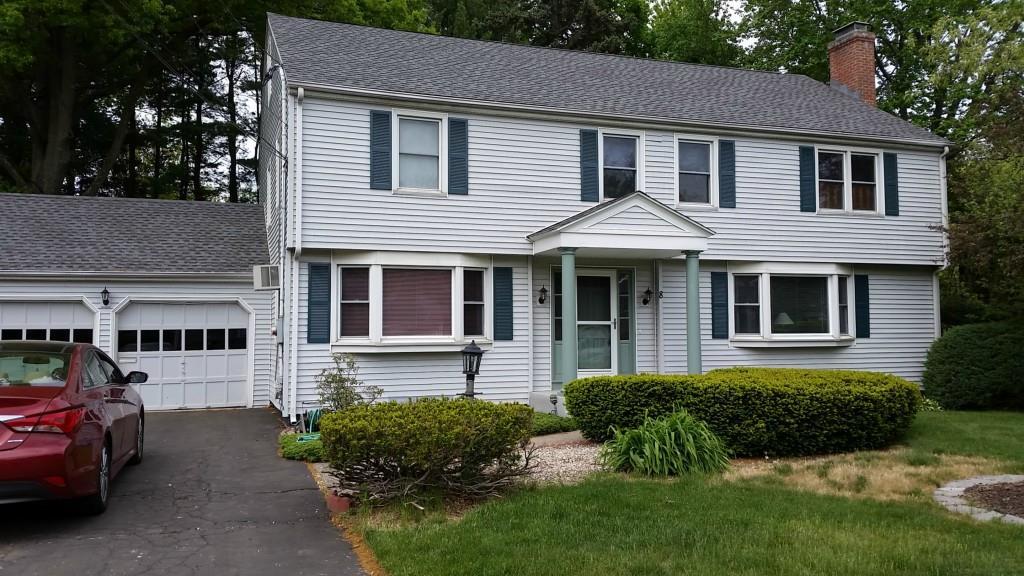8 Tanglewood Road West Hartford, CT 06117 - Photo 1 of 1 a front view of a house with a yard outdoor seating and garage