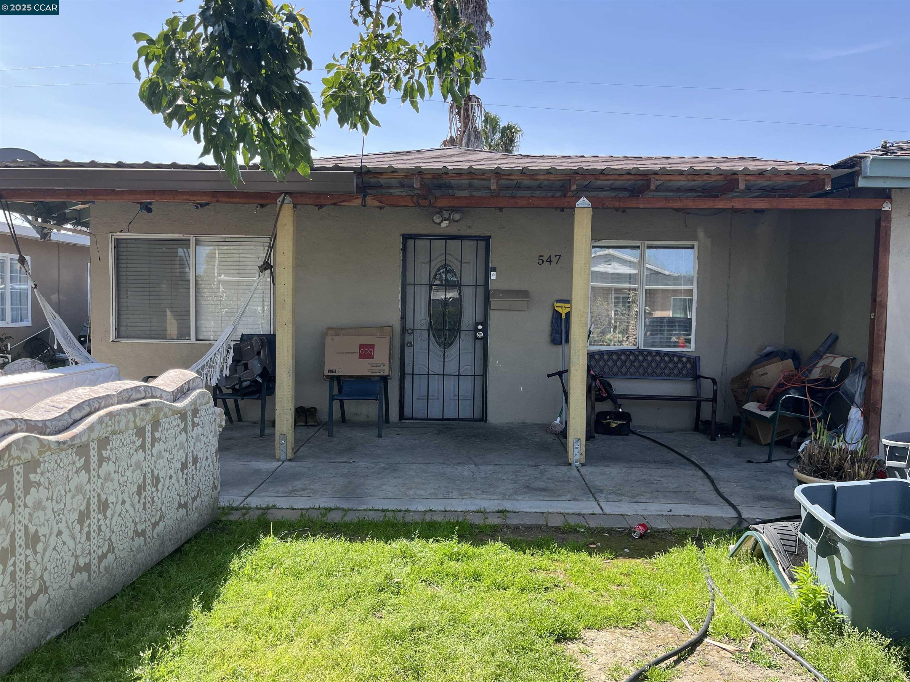 547 Levee Road Bay Point, CA 94565 - Photo 1 of 1 a view of a chair and table in backyard of the house
