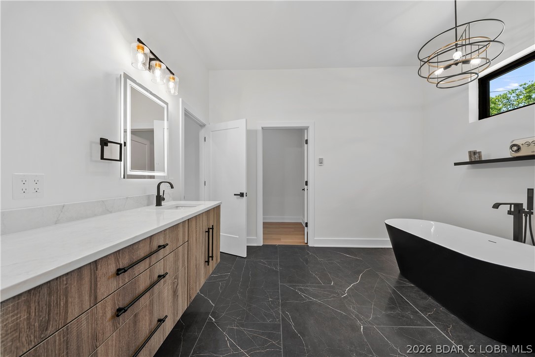 222 Red Bud Road Lake Ozark, MO 65049 - Photo 34 of 64 Spacious vanity area with premium finishes and abu