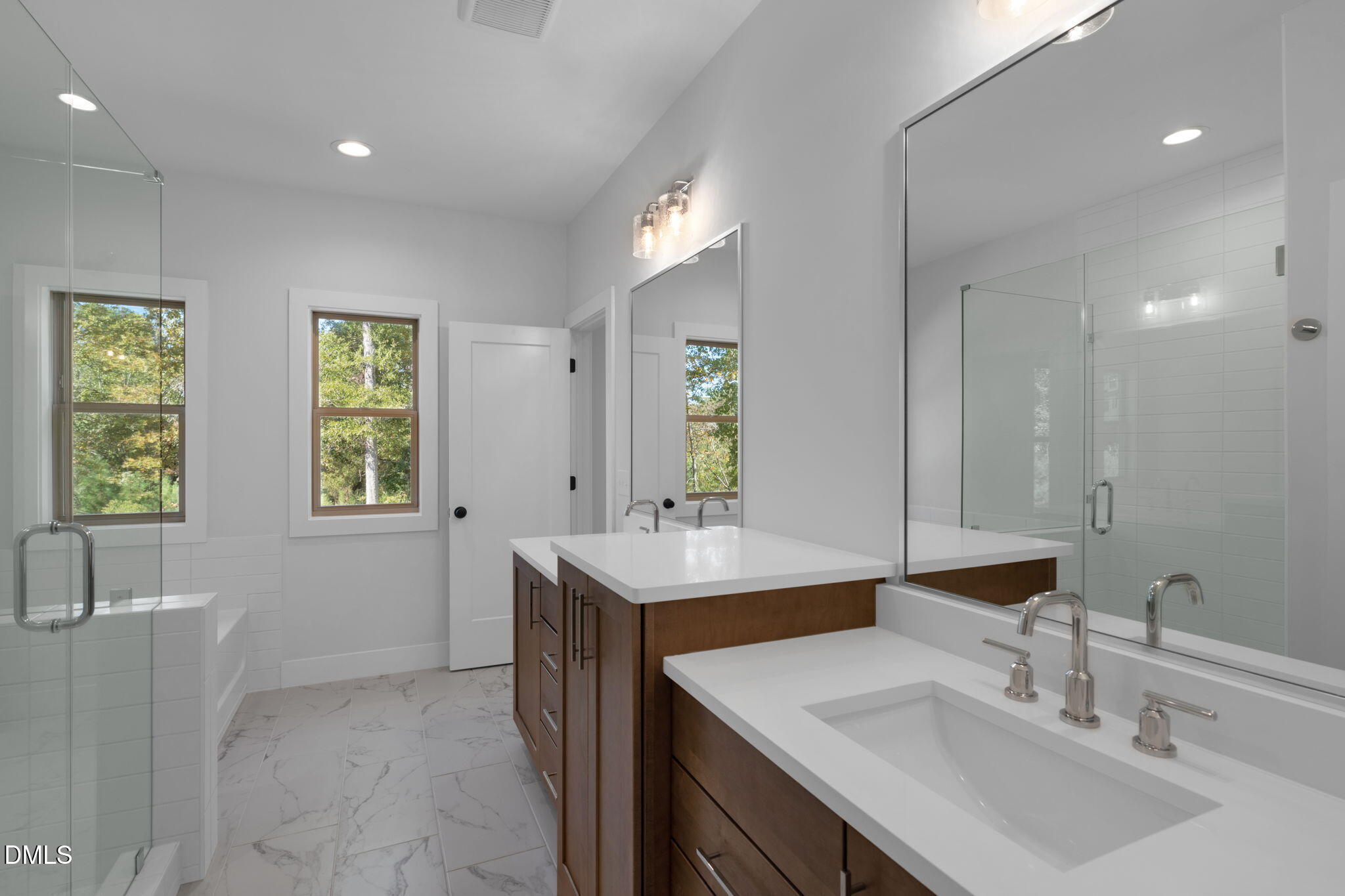 966 Double Helix Road Apex, NC 27523 - Photo 16 of 36 a bathroom with a sink and a mirror