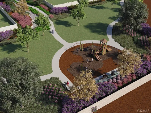 an aerial view of a house with a yard and lake view in back