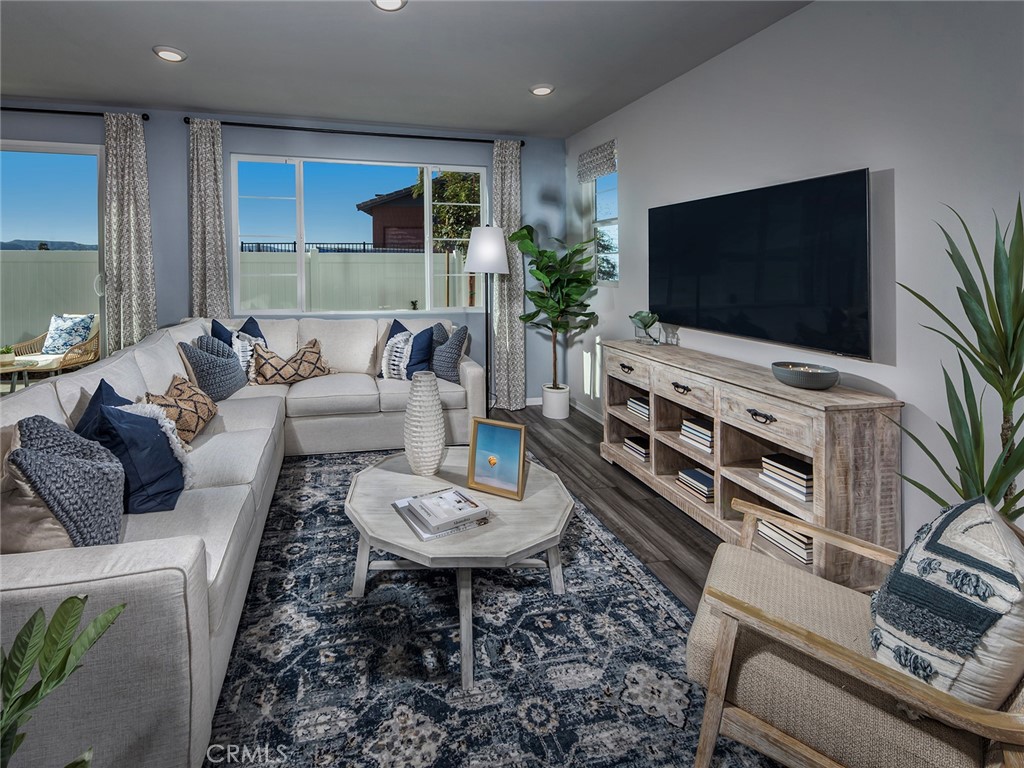 2147 Bergamot Street Redlands, CA 92374 - Photo 6 of 20 a living room with furniture and a flat screen tv