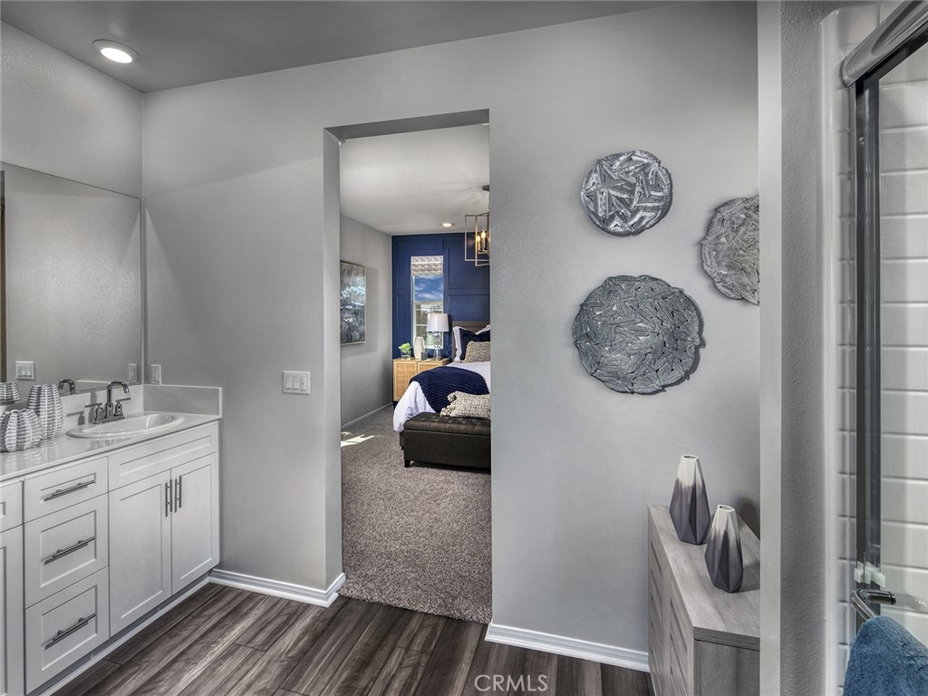 2147 Bergamot Street Redlands, CA 92374 - Photo 8 of 20 a en suite bathroom with a toilet a sink and mirror