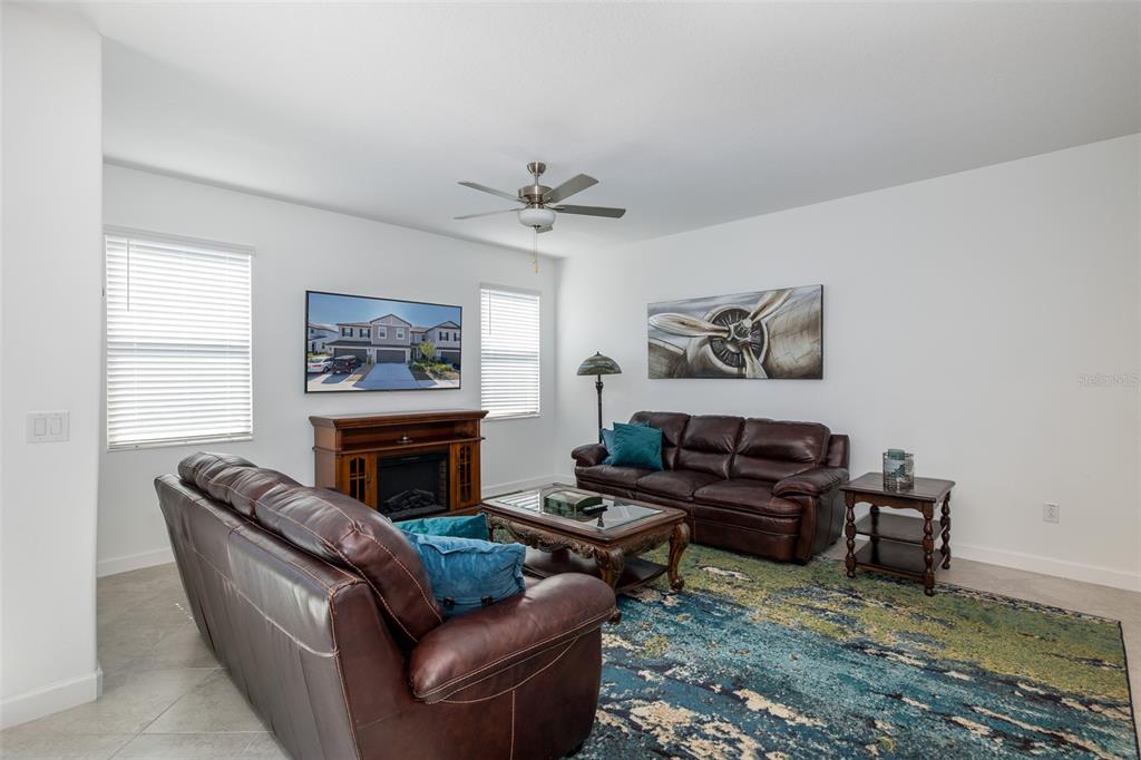 3072 Hover Hall Lane New Port Richey, FL 34655 - Photo 16 of 51 a living room with furniture and a fireplace