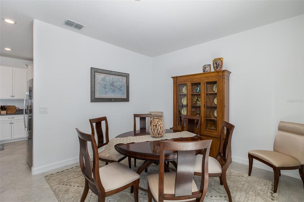 3072 Hover Hall Lane New Port Richey, FL 34655 - Photo 21 of 51 a view of a dining room with furniture and wooden floor
