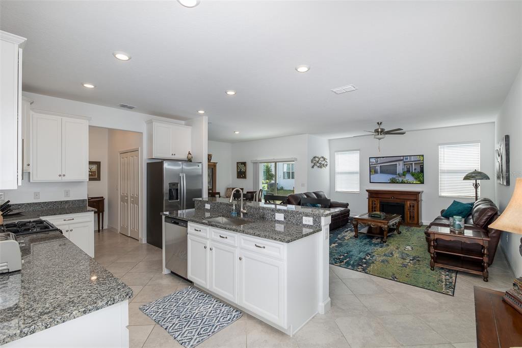 3072 Hover Hall Lane New Port Richey, FL 34655 - Photo 24 of 51 a kitchen with stainless steel appliances granite countertop a sink stove and refrigerator