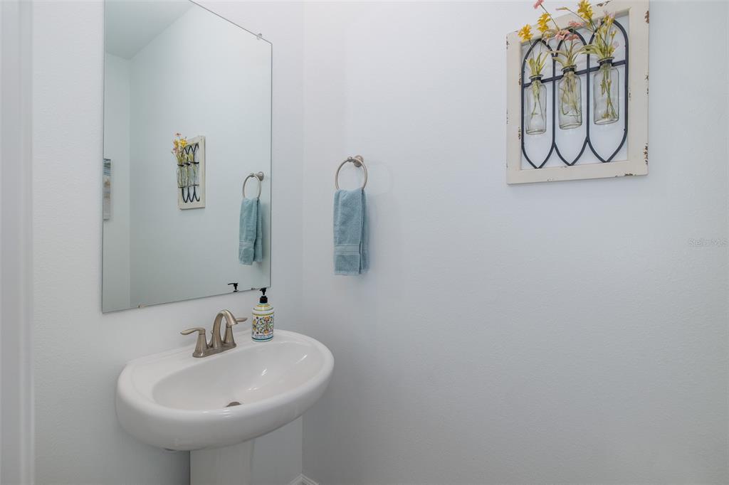 3072 Hover Hall Lane New Port Richey, FL 34655 - Photo 27 of 51 a bathroom with a sink and mirror