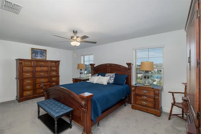 a bedroom with a bed and dresser