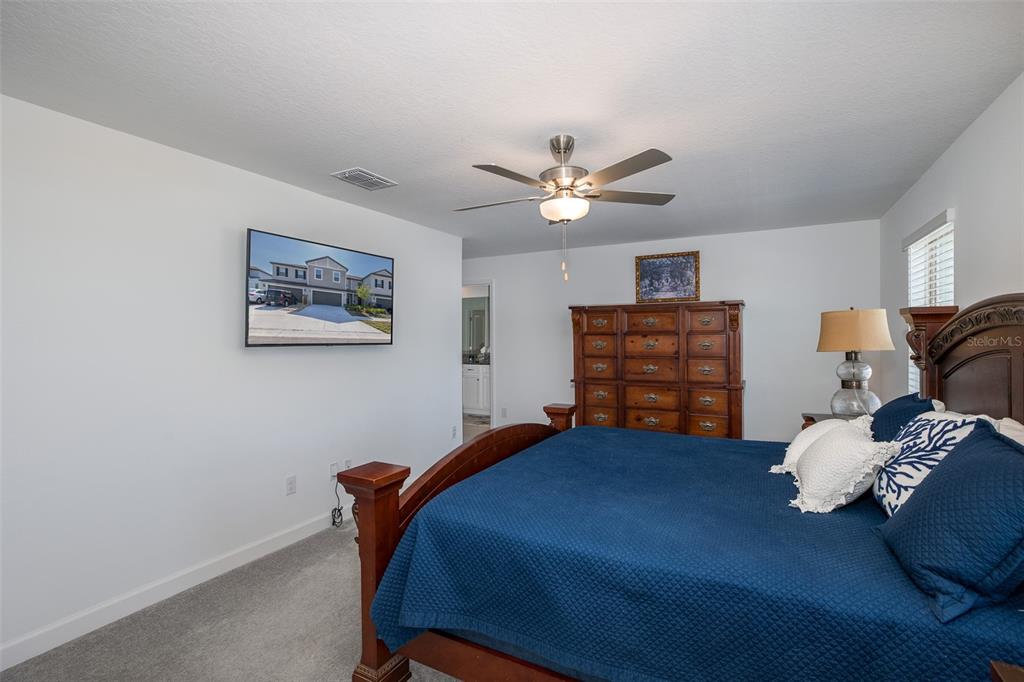 3072 Hover Hall Lane New Port Richey, FL 34655 - Photo 29 of 51 a bedroom with a bed and dresser