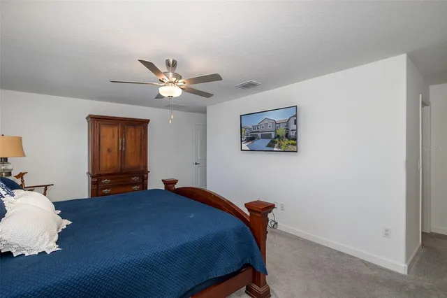 a bathroom with a granite countertop sink a mirror and a shower