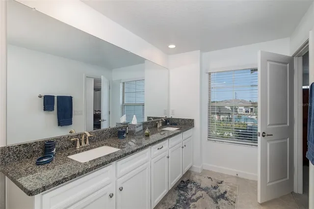 a bathroom with a bathtub and a sink