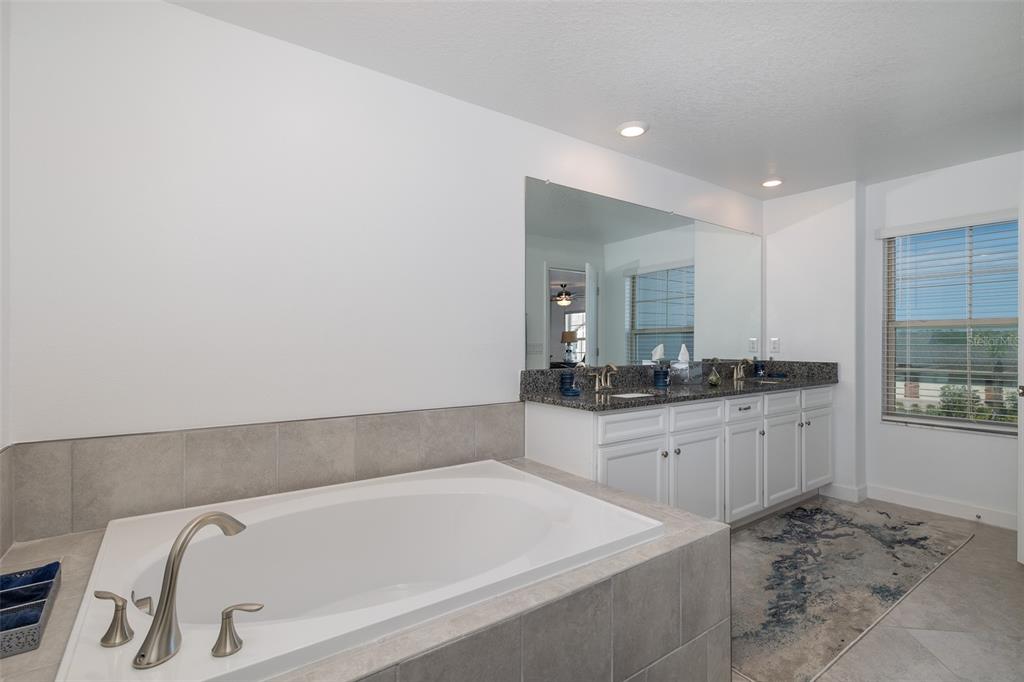 3072 Hover Hall Lane New Port Richey, FL 34655 - Photo 34 of 51 a bathroom with a bathtub and a sink