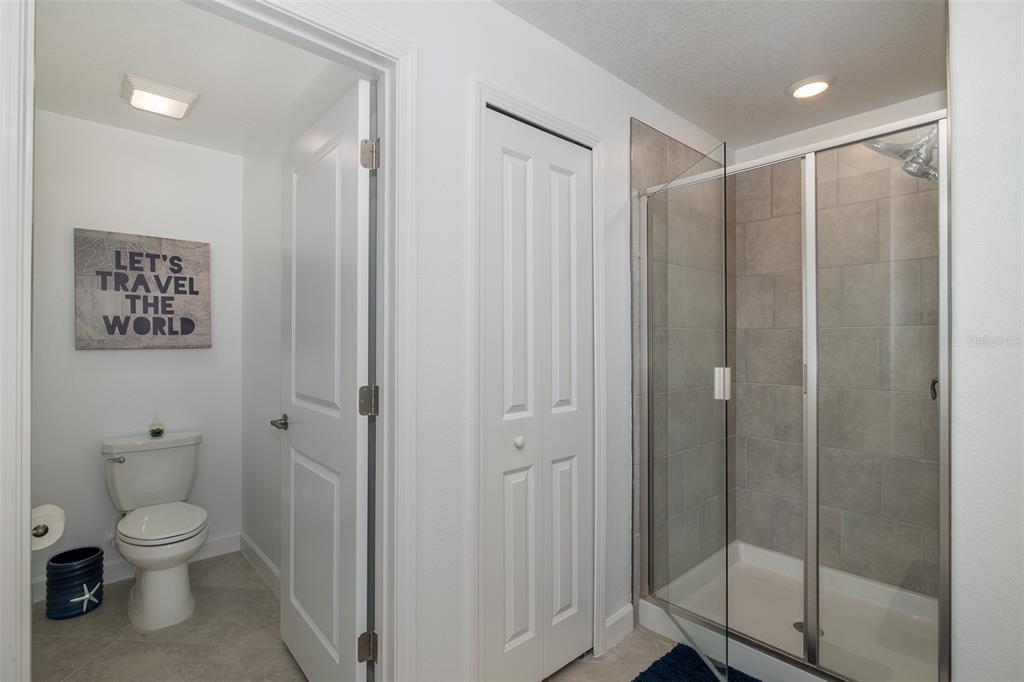 3072 Hover Hall Lane New Port Richey, FL 34655 - Photo 35 of 51 a bathroom with a shower and a toilet