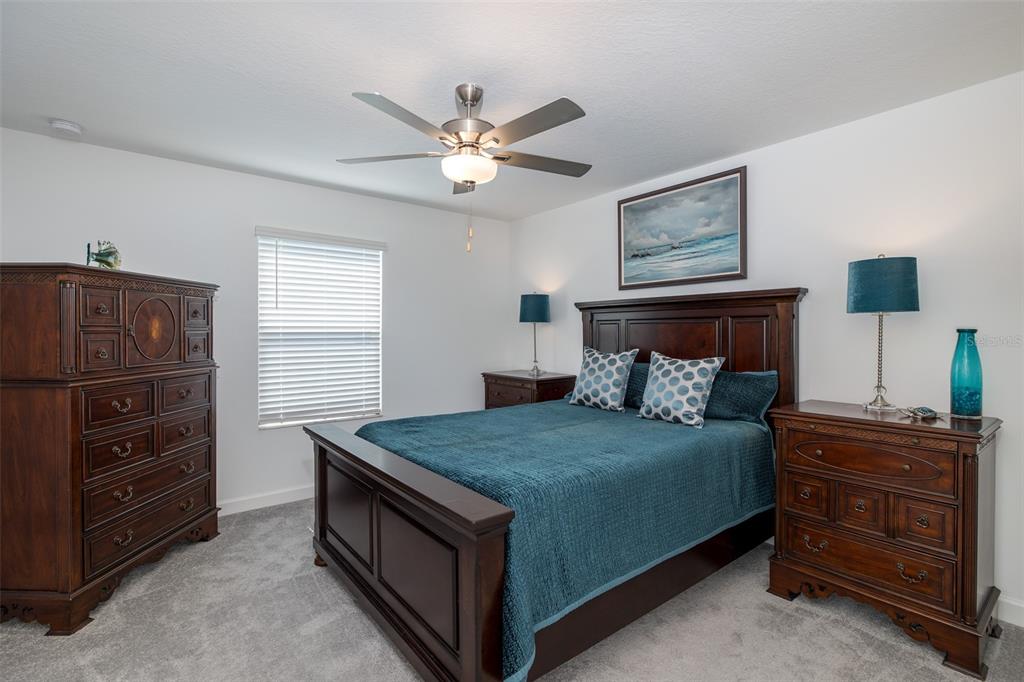 3072 Hover Hall Lane New Port Richey, FL 34655 - Photo 37 of 51 a bedroom with a bed and a dresser