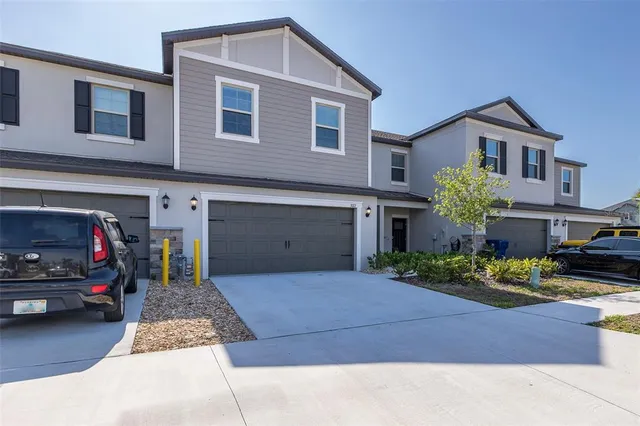 a front view of a house with parking