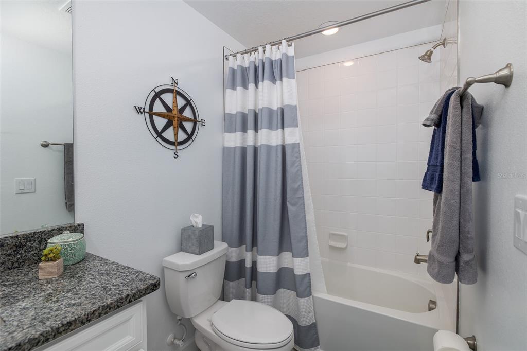 3072 Hover Hall Lane New Port Richey, FL 34655 - Photo 43 of 51 a bathroom with a granite countertop sink toilet and shower