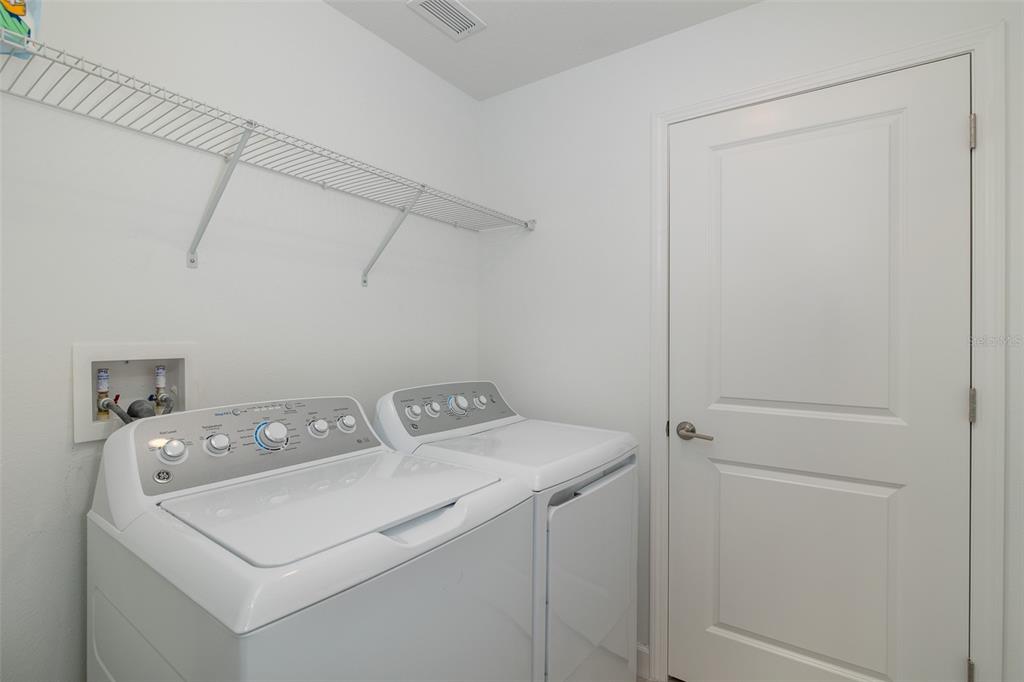 3072 Hover Hall Lane New Port Richey, FL 34655 - Photo 49 of 51 a utility room with dryer and washer