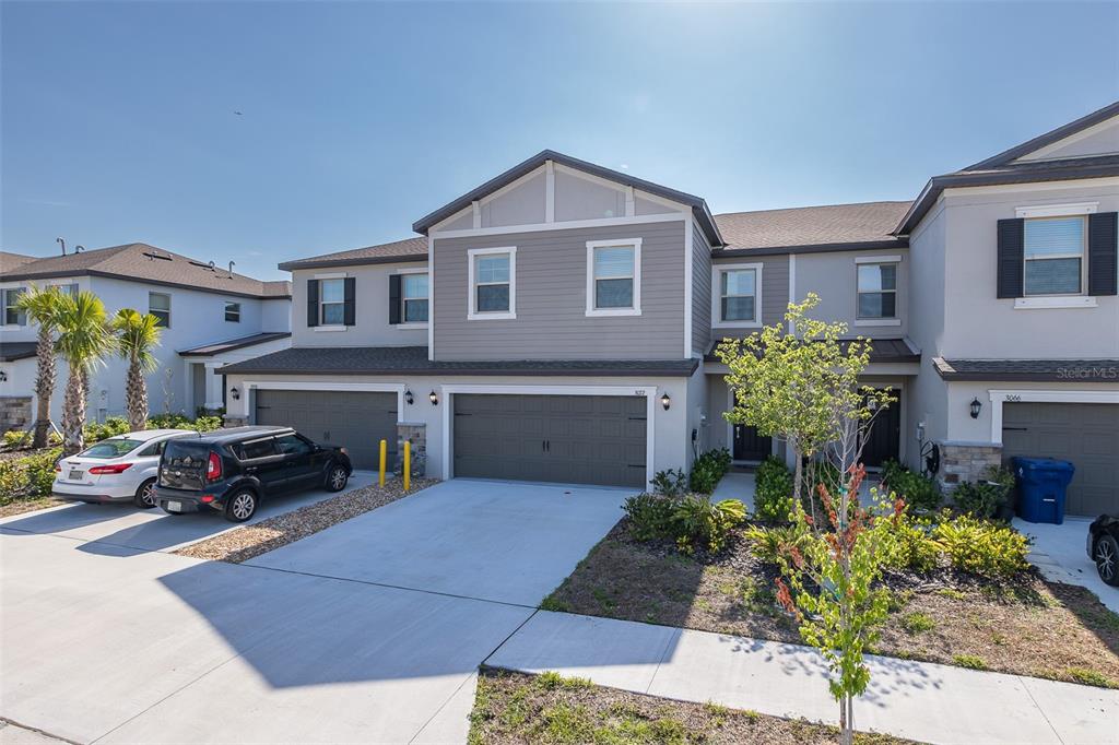 3072 Hover Hall Lane New Port Richey, FL 34655 - Photo 7 of 51 a front view of a house with a garden