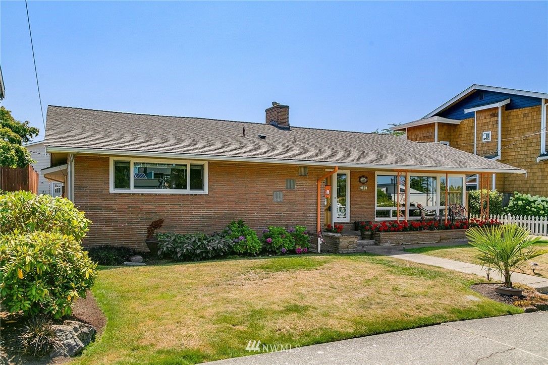 830 Main Street Edmonds, WA 98020 - Photo 2 of 29 a front view of a house with a yard outdoor seating and garage