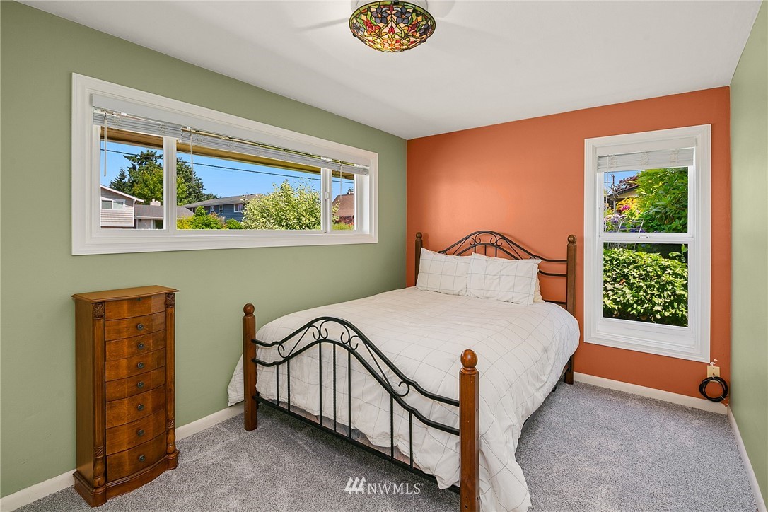 830 Main Street Edmonds, WA 98020 - Photo 11 of 29 a bedroom with a bed and a window