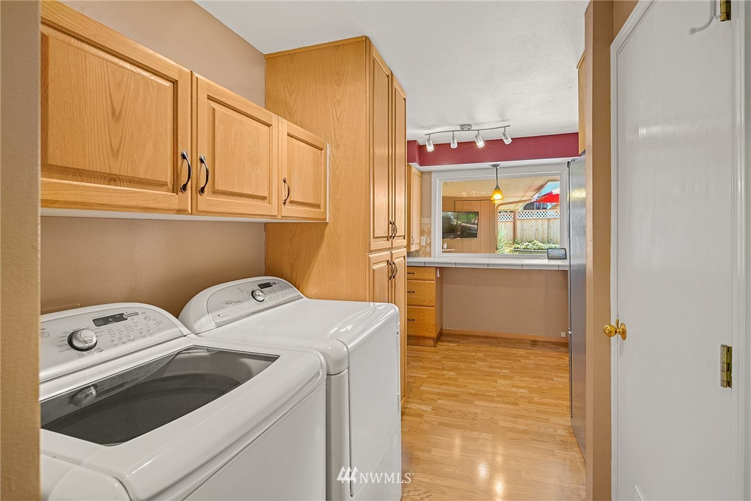 830 Main Street Edmonds, WA 98020 - Photo 14 of 29 a utility room with dryer and washer