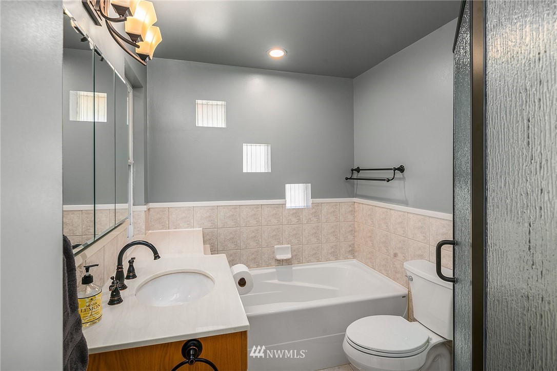 830 Main Street Edmonds, WA 98020 - Photo 15 of 29 a bathroom with a sink a toilet and shower