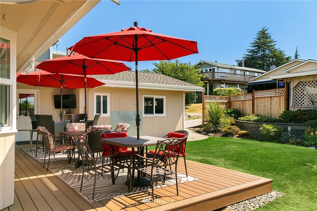 830 Main Street Edmonds, WA 98020 - Photo 16 of 29 a view of a house with backyard sitting area and garden