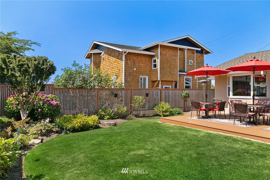 830 Main Street Edmonds, WA 98020 - Photo 18 of 29 a front view of a house with a yard