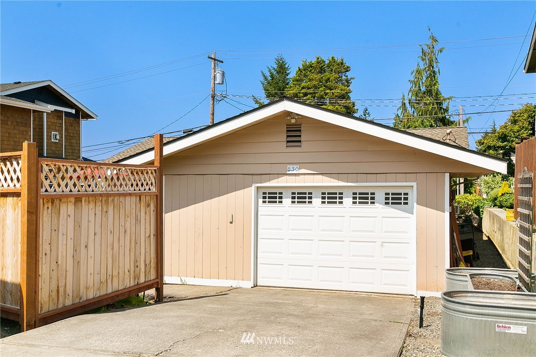 830 Main Street Edmonds, WA 98020 - Photo 19 of 29 a front view of a house with garage