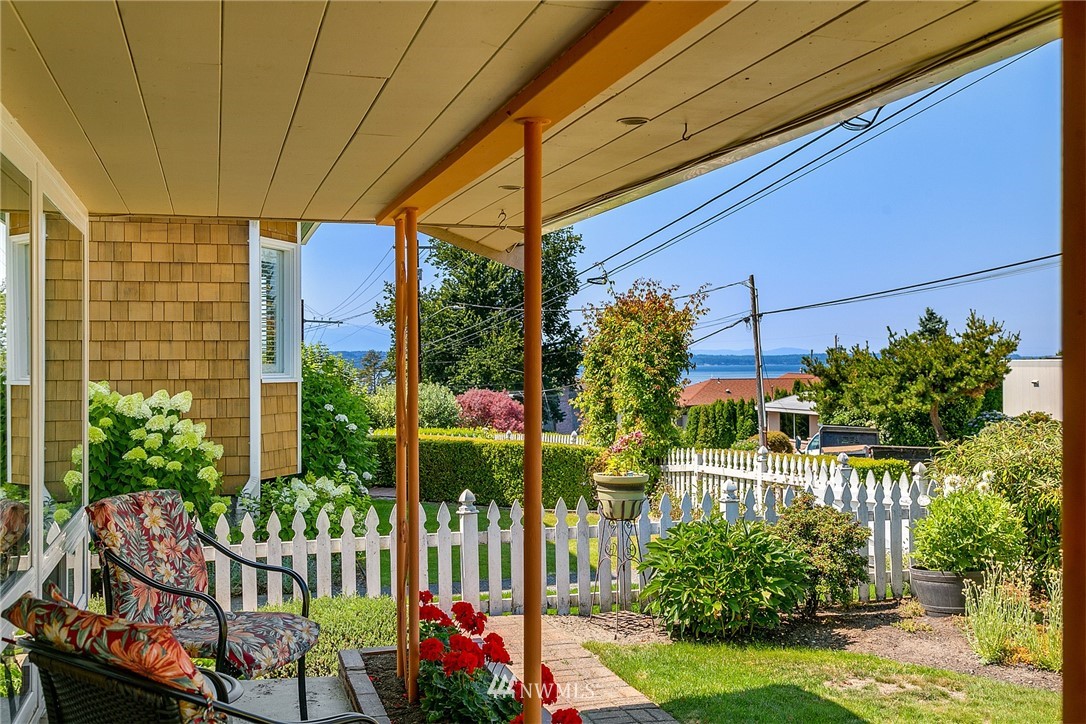 830 Main Street Edmonds, WA 98020 - Photo 3 of 29 a view of a chair and table in the backyard