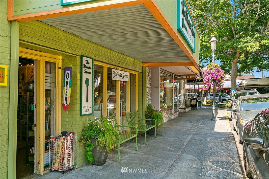 830 Main Street Edmonds, WA 98020 - Photo 27 of 29 a view of a patio with table and chairs potted plants and floor to ceiling window