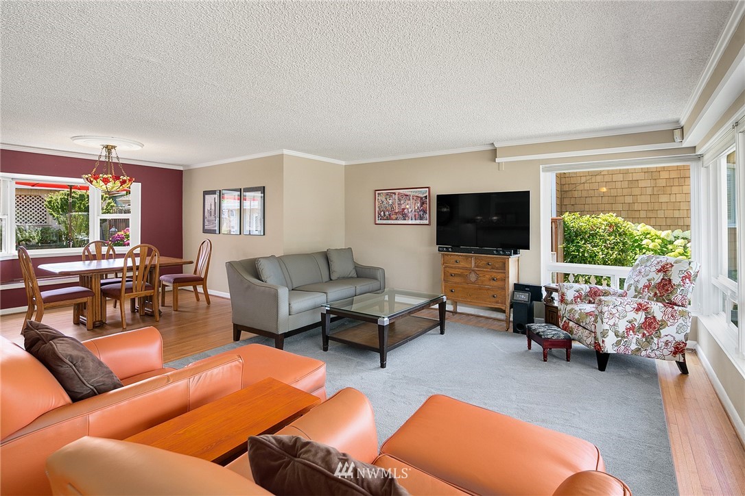 830 Main Street Edmonds, WA 98020 - Photo 4 of 29 a living room with furniture and a flat screen tv