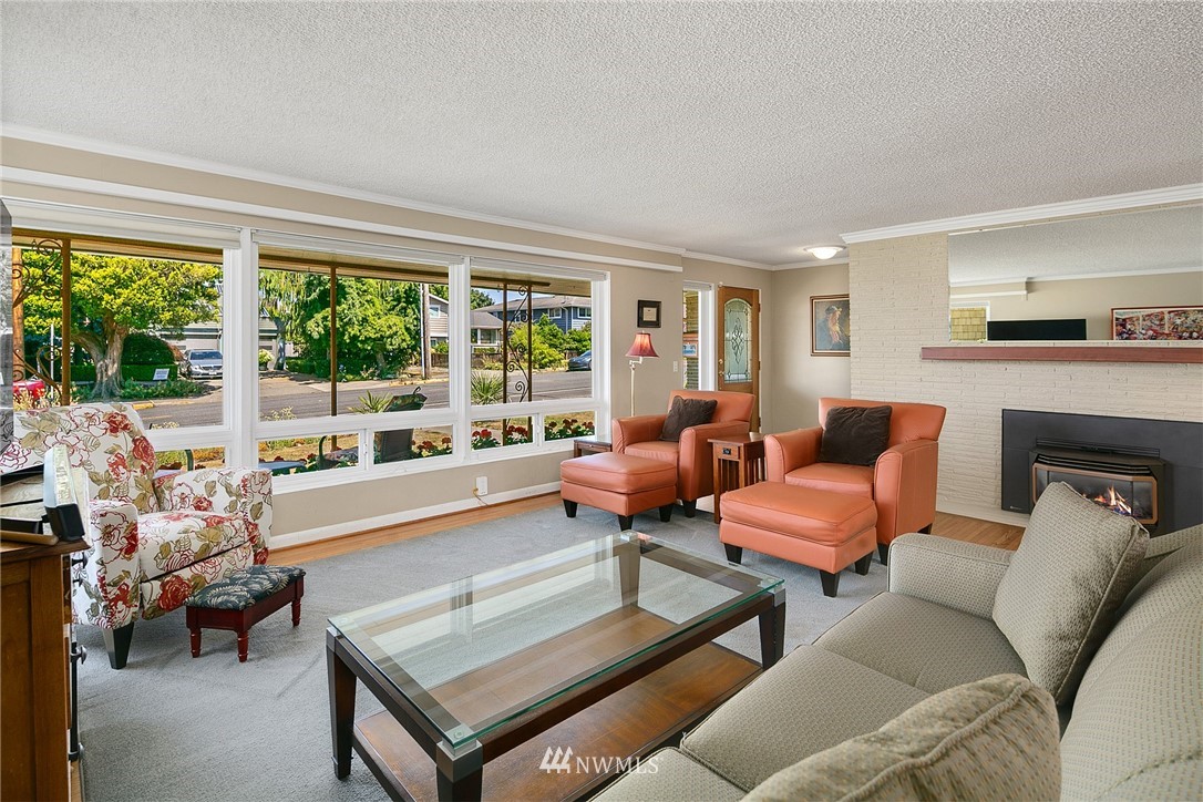 830 Main Street Edmonds, WA 98020 - Photo 6 of 29 a living room with furniture and a fireplace