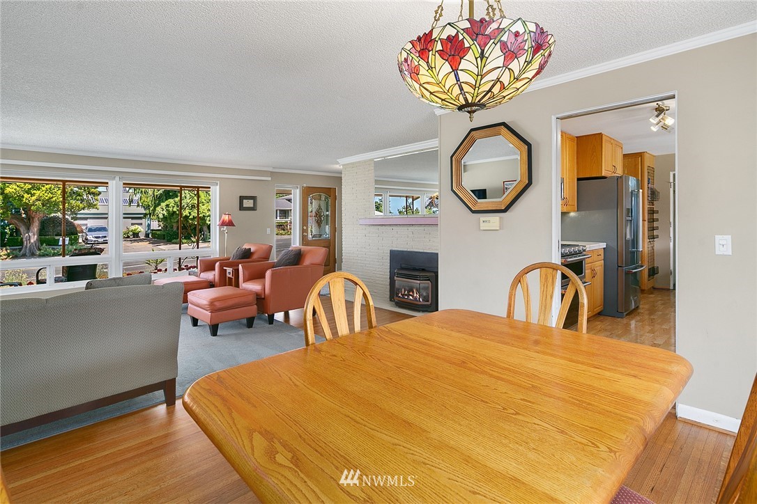 830 Main Street Edmonds, WA 98020 - Photo 8 of 29 a living room with fireplace furniture and a large window
