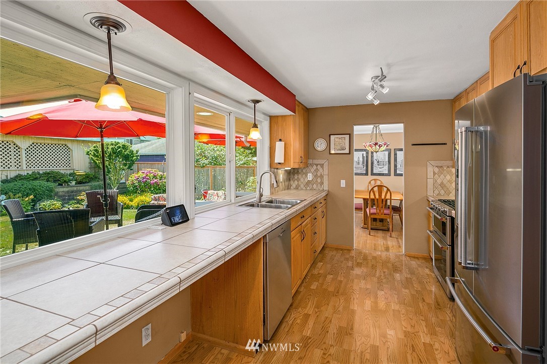 830 Main Street Edmonds, WA 98020 - Photo 10 of 29 a view of a kitchen with a sink and microwave