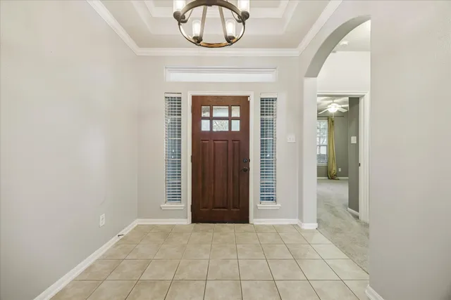 en empty room with a mirror and a sink